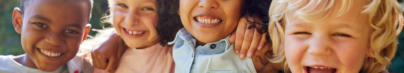 a line of smiling kids